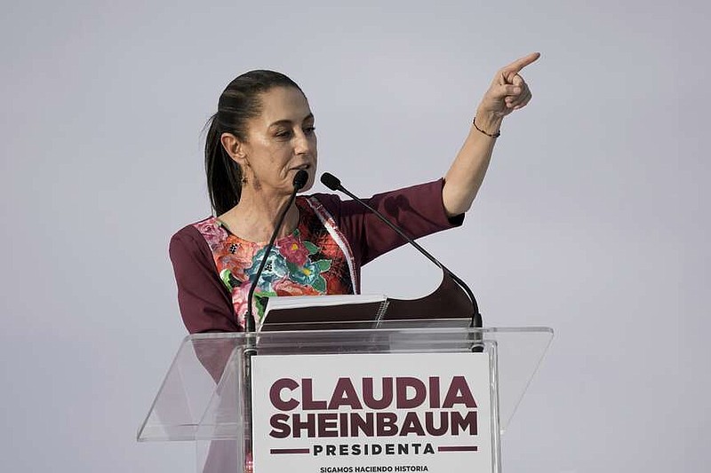 FILE - Presidential candidate Claudia Sheinbaum speaks during her opening campaign rally at the Zocalo in Mexico City, Friday, March 1, 2024. General Elections are set for June 2. Mexico's presidential candidates on Monday, March 11, 2024, signed a commitment for peace with Catholic Church leaders that proposes strategies to reduce the violence in the country.(AP Photo/Marco Ugarte, File)