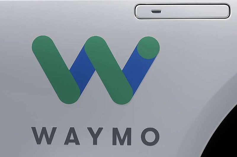 FILE - In this May 8, 2018, file photo, a Waymo logo is displayed on the door of a car at the Google I/O conference in Mountain View, Calif. Robotaxis are hitting the streets of Los Angeles. Google spinoff Waymo says on Thursday, March 14, 2024 it will begin offering free rides to a some of the roughly 50,000 people who have signed up for its driverless ride-hailing service in the second largest U.S. city. (AP Photo/Jeff Chiu, File)