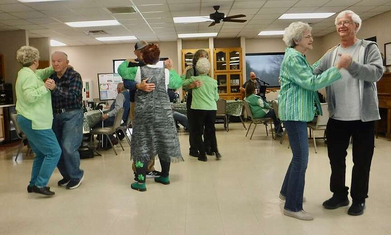 Susan Holland/Westside Eagle Observer Several couples enjoy dancing to the music of the Prairie Roads Band Friday morning, March 15, at the Billy V. Hall Senior Activity Center, during the Center's St. Patrick's Day celebration. The Prairie Roads Band entertains at the Center on the third Friday of each month from 9:30 to 11:30 a.m.