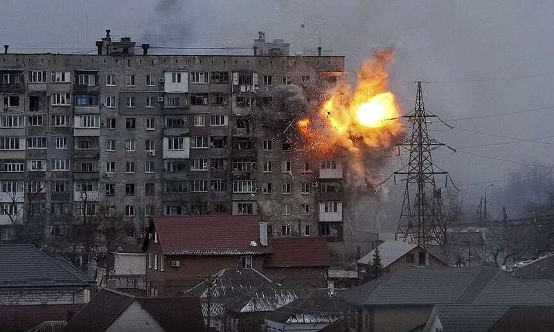 An explosion erupts from an apartment building after a Russian army tank fired on it March 11, 2022, in Mariupol, Ukraine. The image is part of the documentary film "20 Days in Mariupol," which has been nominated for best documentary at the Academy Awards.

(File Photo/AP/Evgeniy Maloletka)