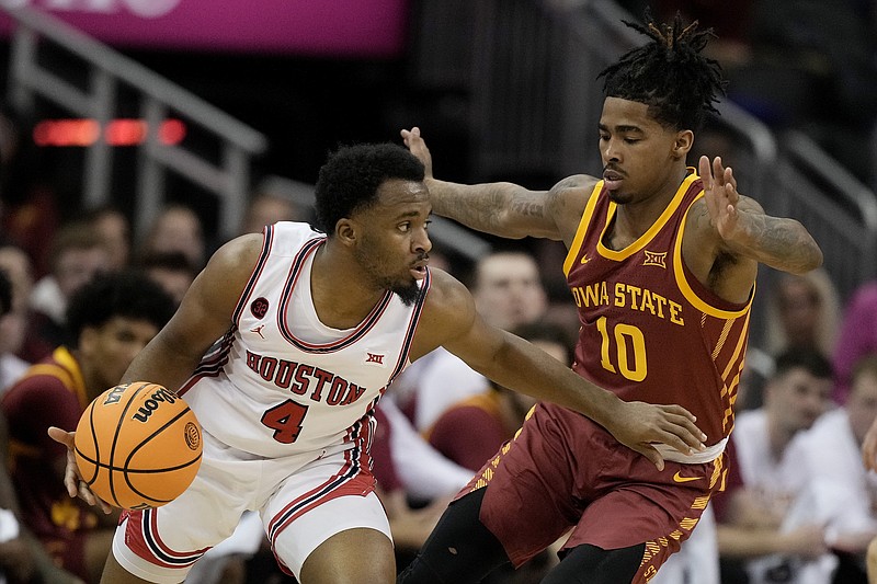 Houston guard L.J. Cryer (4) drives past Iowa State guard Keshon Gilbert (10) during the first half of an NCAA college basketball game in the championship of the Big 12 Conference tournament, Saturday, March 16, 2024, in Kansas City, Mo. (AP Photo/Charlie Riedel)
