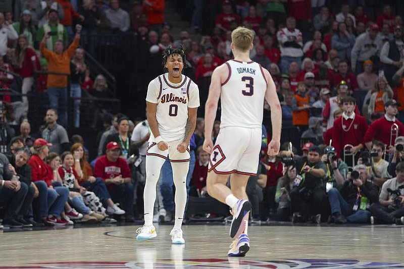 Illinois guard Terrence Shannon Jr. (0) celebrates toward forward Marcus Domask (3) as time expires during the team's win against Wisconsin in an NCAA college basketball game in the championship of the Big Ten Conference tournament, Sunday, March 17, 2024, in Minneapolis. (AP Photo/Abbie Parr)