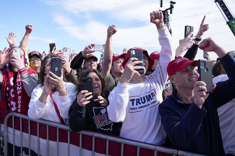 Supporters react as Republican presidential candidate former President Donald Trump arrives at a campaign rally Saturday, March 16, 2024, in Vandalia, Ohio. (AP Photo/Jeff Dean)