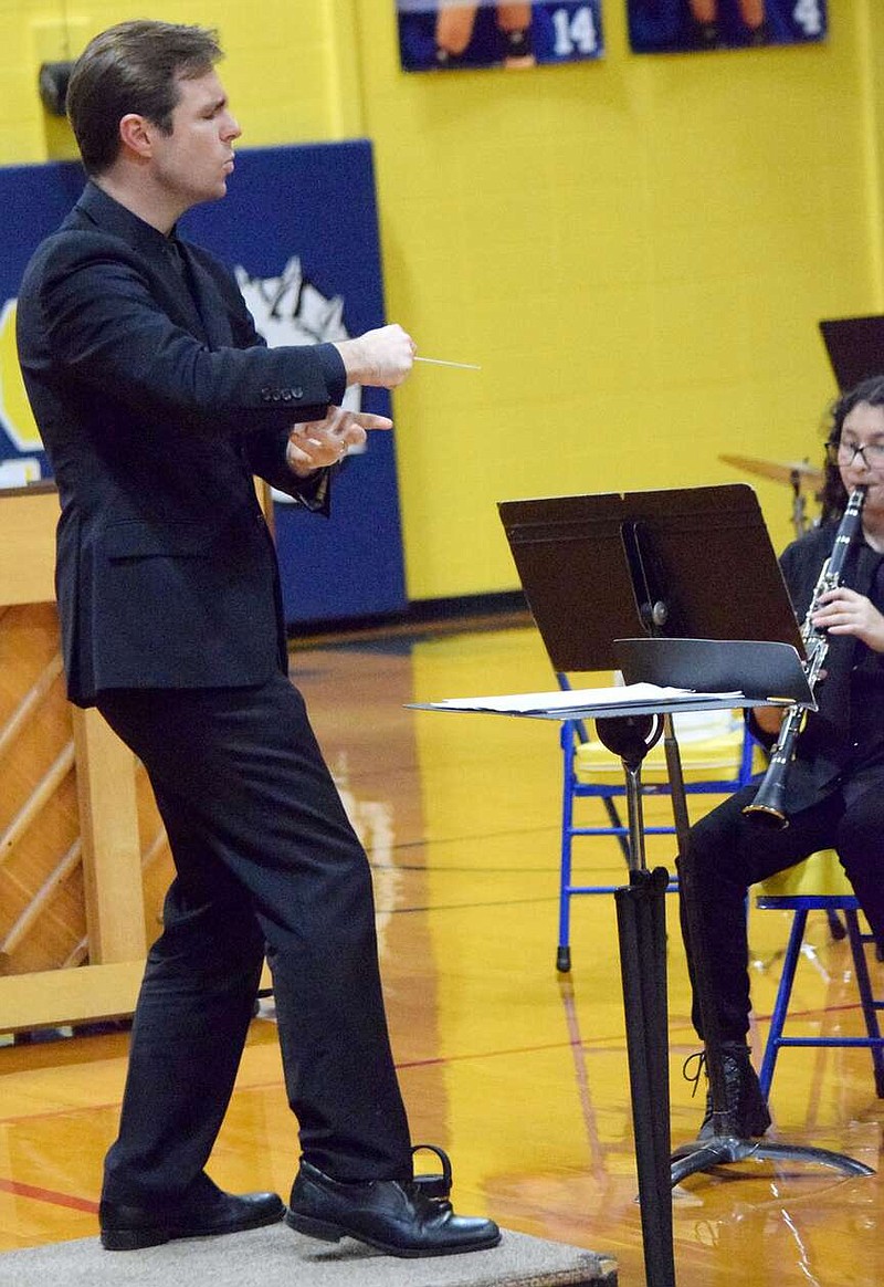 Mike Eckels/Special to the Eagle Observer Jesse Wyatt Owens directs the Decatur High School band in the first of four pieces during the December 4, 2023, DHS Band Christmas concert in Decatur. Owen's band earned high honors during an evaluation concert in Bentonville on March 7.