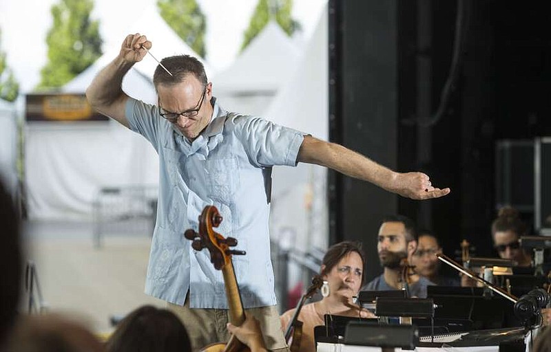 NWA Democrat-Gazette/BEN GOFF @NWABENGOFF
Paul Haas, music director of the Symphony of Northwest Arkansas, conducts Wednesday, July 3, 2019, during rehearsal at the Walmart Arkansas Music Pavilion in Rogers.