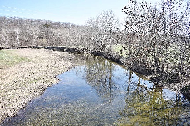 Democrat photo/Garrett Fuller — Spring-like weather and the clear Moniteau Creek made for a tranquil scene March 10 along Hopewell Road in southern Cooper County.