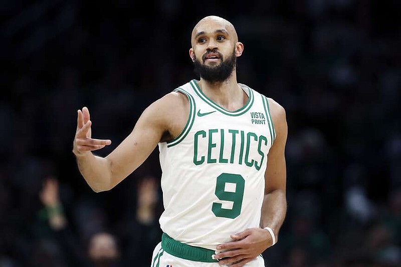Boston Celtics' Derrick White reacts after making a 3-pointer during the first half of an NBA basketball game against the Detroit Pistons, Monday, March 18, 2024, in Boston. (AP Photo/Michael Dwyer)