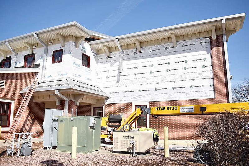 Democrat photo/Garrett Fuller — With the old siding removed, a crew with Rhad Baker Construction added moisture barriers to California City Hall — seen here installed March 12 on the facility's southeastern corner.