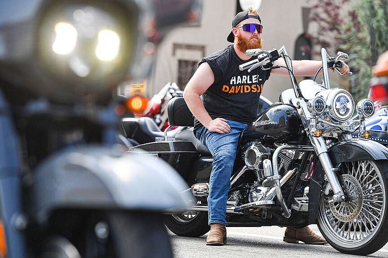 A motorist waits at a traffic light while riding a motorcycle along Garrison Avenue on May 6 during day two of the Steel Horse Rally in downtown Fort Smith. Visit nwaonline.com/photo for today's photo gallery.

(File Photo/River Valley Democrat-Gazette/Hank Layton)