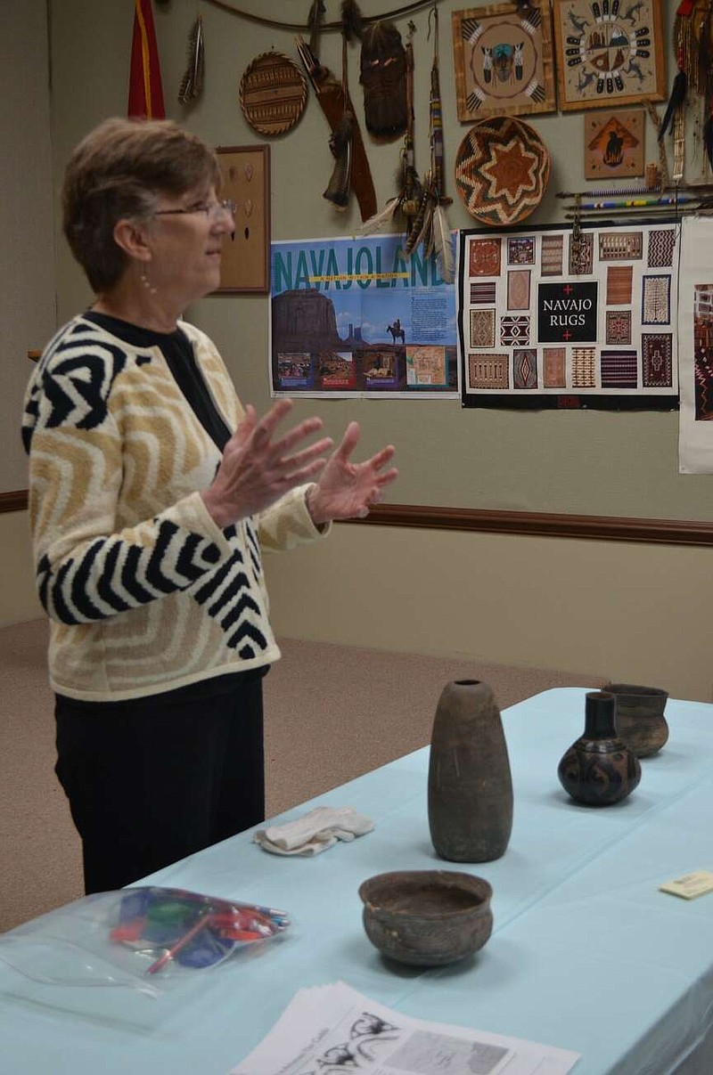 Dr. Mary Beth Trubitt addresses a large gathering at the Dallas County Museum in Fordyce on Friday, explaining the significance of the ancient Caddo pottery being displayed. (Special to The Commercial/Richard Ledbetter)