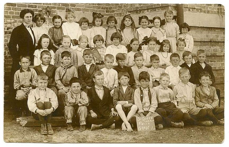 De Queen, 1912: Some 112 years ago, the first grade class and their teacher posed outside their school. Seated to the left of the chalk sign in the bottom row is a boy in short pants and no shoes. The faces reflected a wide range of emotions. The stoic teacher would have earned about $300 for a year's work with that class.

Send questions or comments to Arkansas Postcard Past, P.O. Box 2221, Little Rock, AR 72203