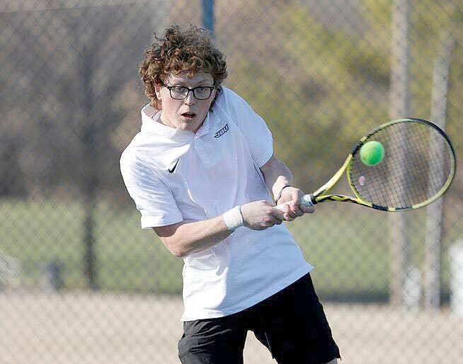 Photo courtesy of John Brown University John Brown University tennis player Spencer Keeter is shown in a match against Missouri Baptist on March 13.