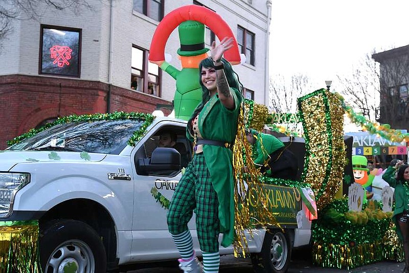 A float for Oaklawn Racing Casino Resort makes its way down Bridge Street during the First Ever 21st Annual World's Shortest St. Patrick's Day Parade on Sunday. (The Sentinel-Record/Lance Brownfield)