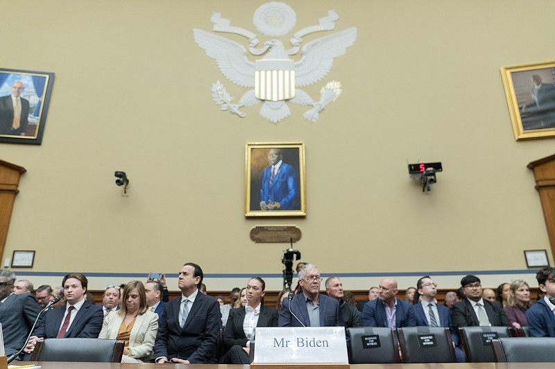 A chair reserved for Hunter Biden, President Joe Biden's son, is seen during the House Oversight and Accountability Committee hearing on Capitol Hill in Washington, Wednesday, March 20, 2024.  Hunter Biden declined to appear at the hearing after having testified privately last month.  (AP Photo/Jose Luis Magana)