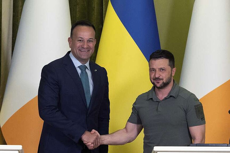 FILE - Ireland's Prime Minister Leo Varadkar, left, shakes hands with Ukraine's President Volodymyr Zelenskyy during a joint news conference at Horodetskyi House in Kyiv, Ukraine, Wednesday July 19, 2023. Irish Prime Minister Leo Varadkar says he will step down as leader of the country as soon as a successor is chosen. Varadkar announced Wednesday he is quitting immediately as head of the center-right Fine Gael party, part of Ireland's coalition government. (Clodagh Kilcoyne/Pool via AP, File)