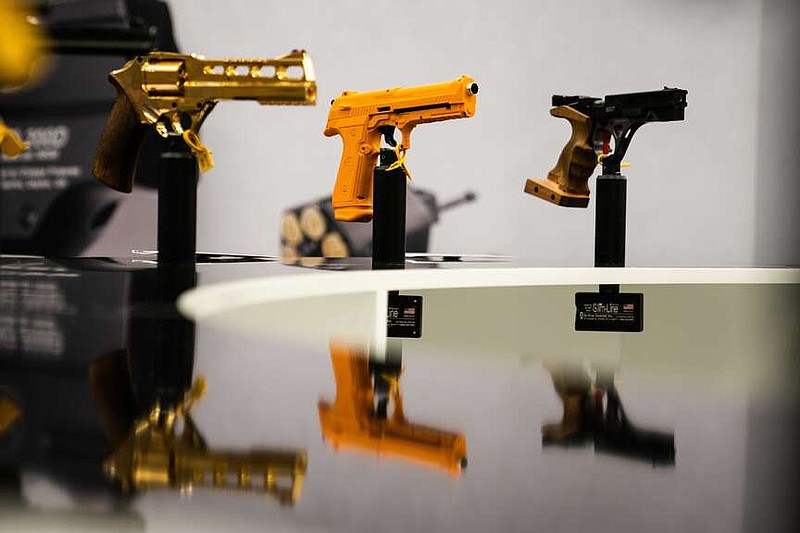 Glock pistols are displayed during the National Rifle Association's annual convention in April 2023 in Indianapolis. (Demetrius Freeman/The Washington Post)