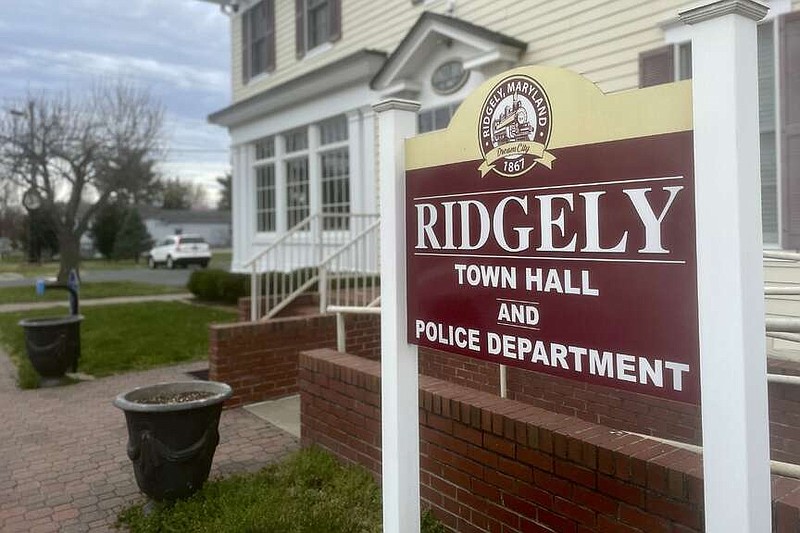 The sign outside the town government and police department offices stands Friday, March 15, 2024, in Ridgely, Md. Ridgely officials announced last week that their entire police department had been suspended pending the results of an investigation by state prosecutors. (AP Photo/Lea Skene)