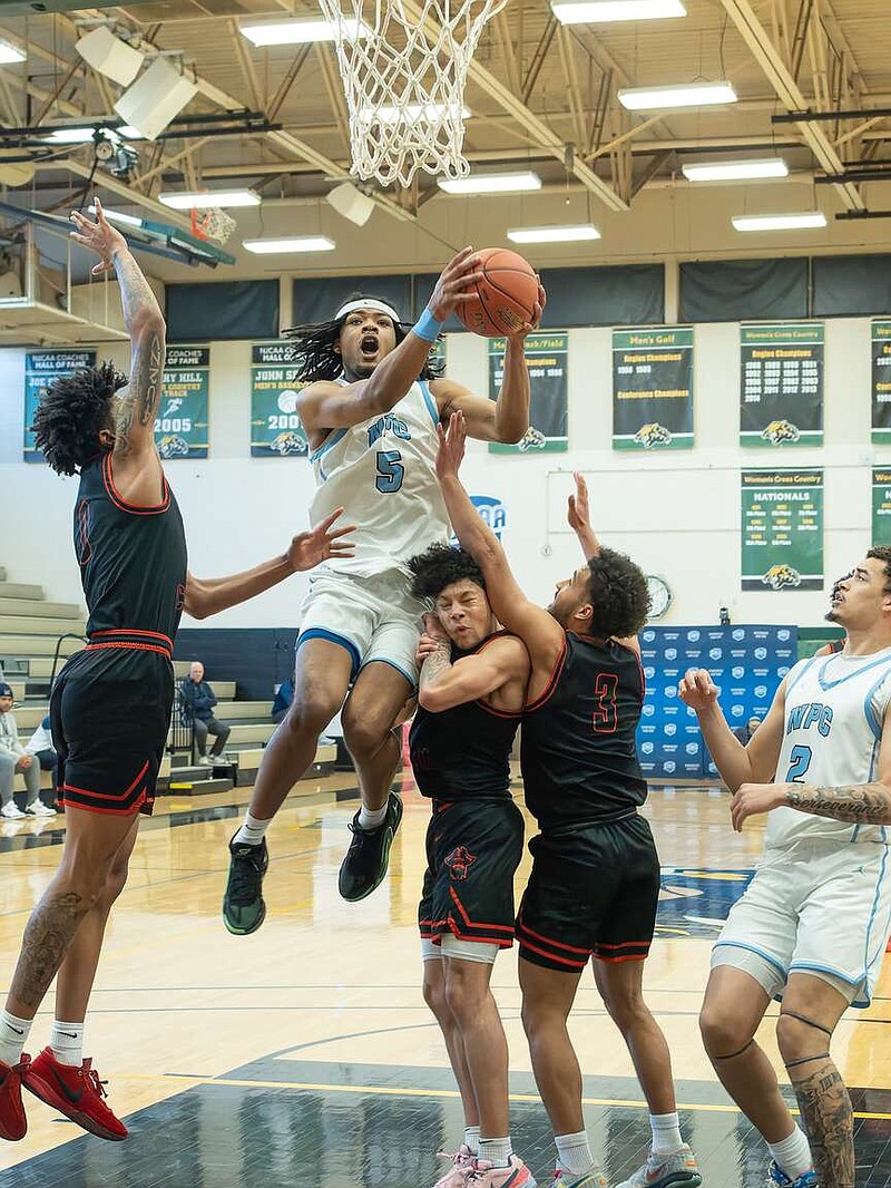The Nighthawks' Nakavieon White drives inside for a layup during the team's quarterfinal win, Wednesday, in the NJCAA DII Men's Basketball Championship in Danville, Ill. (Submitted photo courtesy of NJCAA)