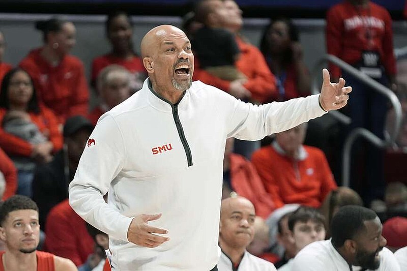 FILE - SMU head coach Rob Lanier yells from the sidelines during the first half of an NCAA college basketball game against Memphis in Dallas, Sunday, Feb. 18, 2024. SMU fired Lanier after two seasons as coach on Thursday, March 21, 2024. (AP Photo/LM Otero, File)
