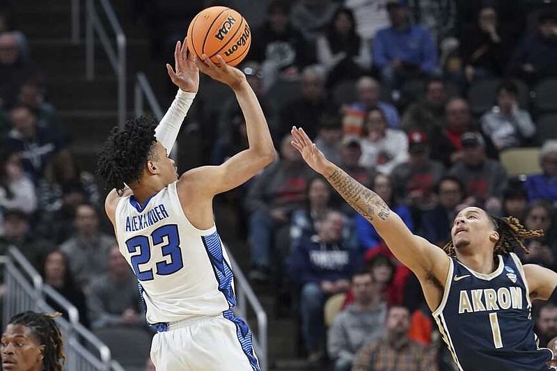 Creighton's Trey Alexander shoots over Akron's Shammah Scott during the first half of a college basketball game in the first round of the NCAA men's tournament Thursday, March 21, 2024, in Pittsburgh. (AP Photo/Matt Freed)