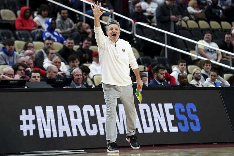 Oakland coach Greg Kampe calls out to the team during the first half of a college basketball game against Kentucky in the first round of the men's NCAA Tournament on Thursday, March 21, 2024, in Pittsburgh. (AP Photo/Matt Freed)