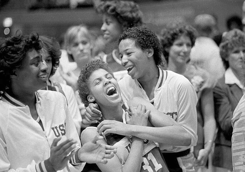 University of Southern California's Cheryl Miller, center left, and Cynthia Cooper, center right, rejoice after winning the NCAA women's basketball championship by defeating the University of Tennessee 72-61 in Los Angeles, April 1, 1984. (AP Photo/Lennox McLendon, File)