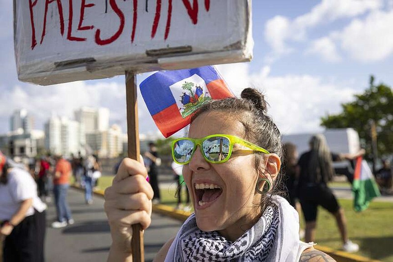 Protest against the visit of the Vice President Kamala Harris to Puerto Rico, in San Juan, Puerto Rico, Friday, March. 22, 2024. (AP Photo/Alejandro Granadillo)