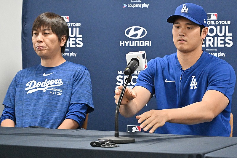 This picture taken on March 16, 2024, shows Los Angeles Dodgers' Shohei Ohtani (right) and his interpreter Ippei Mizuhara (left) attending a press conference at Gocheok Sky Dome in Seoul ahead of the 2024 MLB Seoul Series baseball game between Los Angeles Dodgers and San Diego Padres. The Los Angeles Dodgers said on March 21 they had fired Shohei Ohtani's interpreter after the Japanese baseball star's representatives claimed he had been the victim of &quot;a massive theft&quot; reported to involve millions of dollars. (Jung Yeon-je/AFP via Getty Images/TNS)