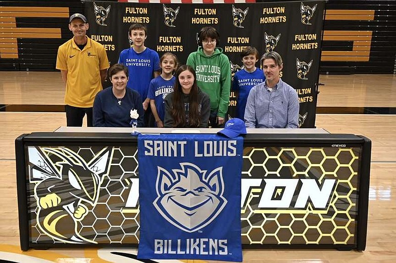 Fulton's Emery Mayfield, joined by her family and Hornets cross country coach George Yates, officially signed for St. Louis University women's cross country Friday at Fulton High School in Fulton. (Fulton Public Schools/Courtesy)