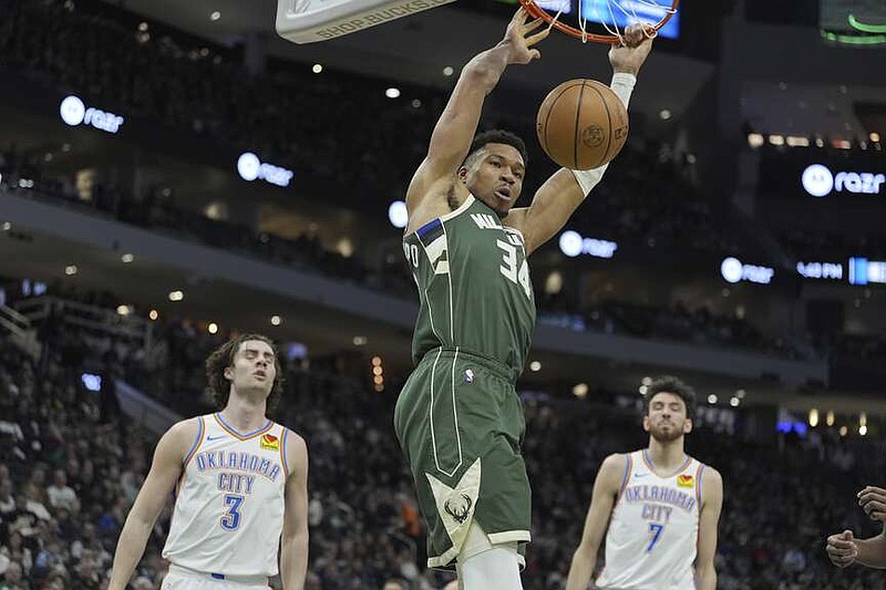 Milwaukee Bucks' Giannis Antetokounmpo dunks during the first half of an NBA basketball game Sunday, March 24, 2024, in Milwaukee. (AP Photo/Morry Gash)