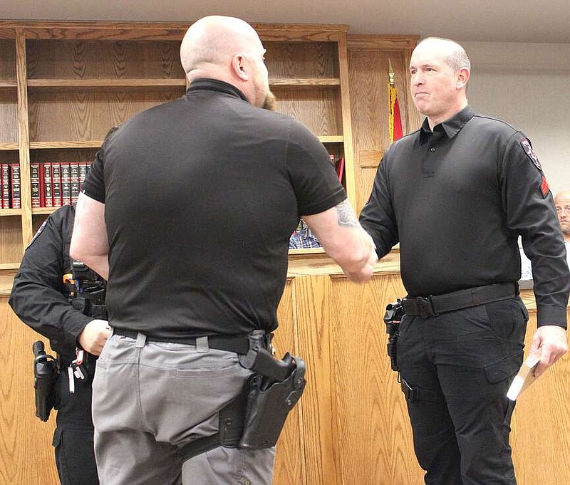 Annette Beard/Pea Ridge TIMES
Police Lt. Rich Fordham presented lifesaving awards to Officer Jacob Kolash and Cpl. Jake Steele at the Pea Ridge City Council meeting Tuesday, March 19, 2024. The two men saved the life of a man who was found unconscious on Dec. 23, 2023, and administered Narcan and performed sternum rub until ambulance personnel arrived.