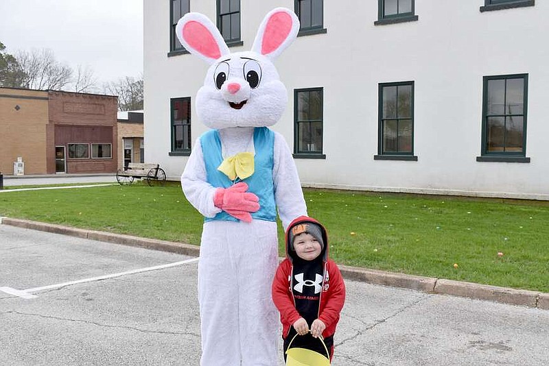 Rachel Dickerson/McDonald County Press
Calen Johnson, 3, is pictured with the Easter Bunny on the Pineville square before the Easter egg hunt on March 23.
