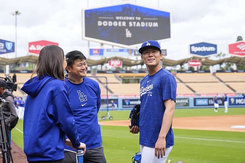 Los Angeles Dodgers pitcher Yoshinobu Yamamoto looks around Dodger Stadium before a spring training game against the Los Angeles Angels in Los Angeles, Sunday. (AP Photo/Ashley Landis)