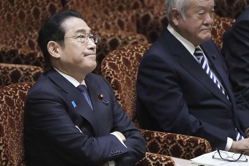 Japanese Prime Minister Fumio Kishida, left, and Finance Minister Shunichi Suzuki, right, attend a parliamentary session of House of Councilors in Tokyo, Monday, March 25, 2024. North Korea said Monday that Prime Minister Kishida has proposed a summit with North Korean leader Kim Jong Un, as the North urged Japan to show sincerity toward improving bilateral ties and realizing their countries' first summit in about 20 years.(Kyodo News via AP)
