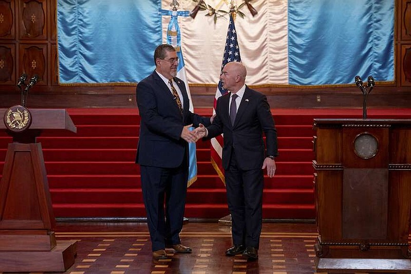 Guatemalan President Bernardo Arevalo shakes hands with U.S. Homeland Security Secretary Alejandro Mayorkas at the start of their joint new conference at the National Palace in Guatemala City, Thursday, March 21, 2024. Mayorkas is in Guatemala for a two day visit. (AP Photo/Santiago Billy)