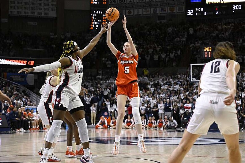 Syracuse guard Georgia Woolley (5) shoots over UConn forward Aaliyah Edwards in the first half of a second-round college basketball game in the NCAA Tournament, Monday, March 25, 2024, in Storrs, Conn. (AP Photo/Jessica Hill)