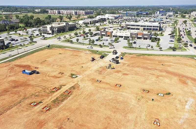Construction is shown, Friday, August 19, 2022 at a dirt lot that will become The District at Pinnacle Hills in Rogers. (NWA Democrat-Gazette/Charlie Kaijo)