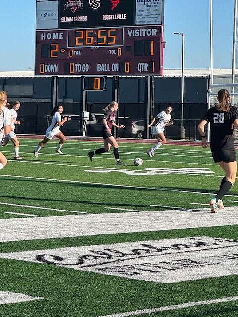 Photograph courtesy of Siloam Springs High School
Ellen Slater of Siloam Springs is surrounded by a host of Russellville players in a match played at Panther Stadium on March 28.