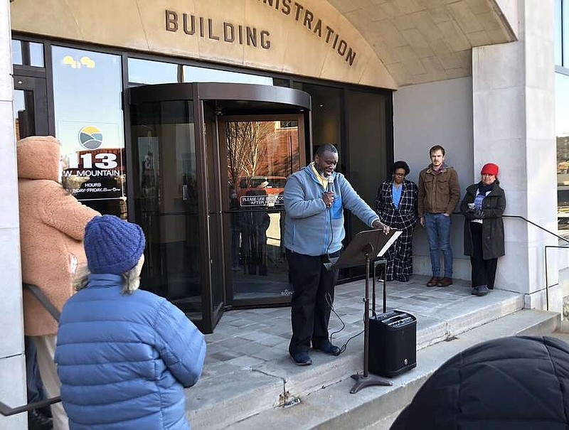 D'Andre Jones, Fayetteville City Council member, speaks March 18 during a rally outside Fayetteville City Hall in support of a resolution he sponsored declaring a housing crisis in the city. The City Council on Tuesday held a workshop to discuss a pair of housing resolutions. (File photo/NWA Democrat-Gazette/Stacy Ryburn)