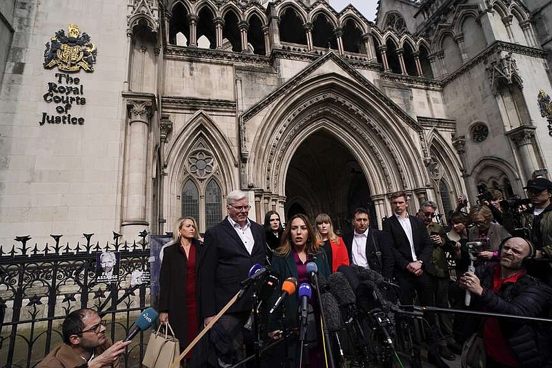 Stella Assange, wife of Wikileaks founder Julian Assange, releases a statement outside the Royal Courts of Justice, in London, Tuesday, March 26, 2024. Two High Court judges said they would grant Assange a new appeal unless U.S. authorities give further assurances about what will happen to him. The case has been adjourned until May 20.(AP Photo/Alberto Pezzali)