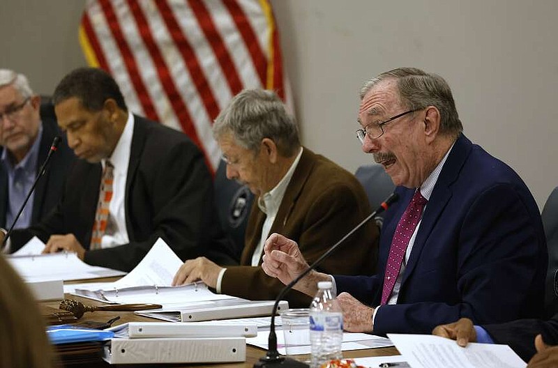 Arkansas Board of Corrections member Dubs Byers (right) speaks while chairman Benny Magness (center) looks over papers during the board meeting on Tuesday, March 26, 2024, in North Little Rock.
(Arkansas Democrat-Gazette/Thomas Metthe)