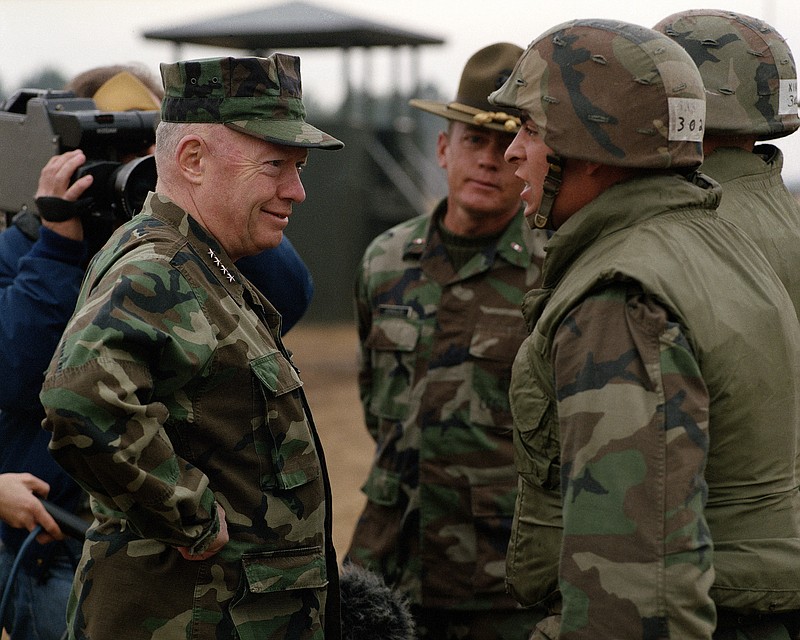 Gen. Gray, commandant of the Marine Corps, talks to a private at Parris Island, S.C., on Feb. 26, 1988. (MUST CREDIT: Department of Defense/National Archives)