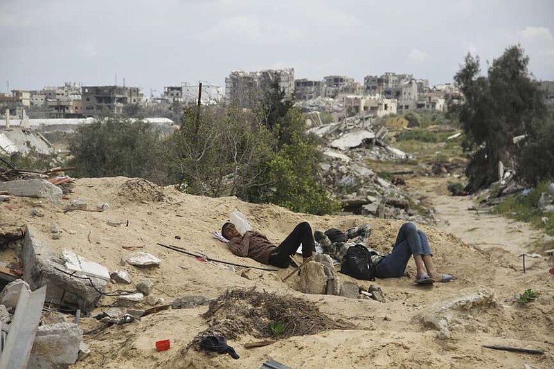 Palestinians wait for humanitarian aid airdrop in Gaza City, Gaza Strip, Monday, March 25, 2024. (AP Photo/Mahmoud Essa)