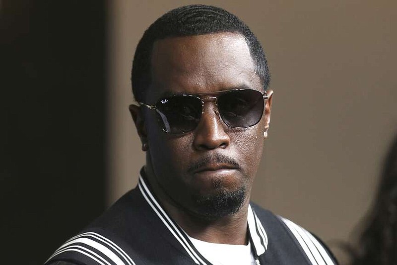 FILE - In this May 30, 2018, file photo, Sean "Diddy" Combs arrives at the LA Premiere of "The Four: Battle For Stardom" at the CBS Radford Studio Center in Los Angeles. Combs' lawyer said Tuesday, March 26, 2024, that the searches of his Los Angeles and Miami properties by federal authorities in a sex-trafficking investigation were ”a gross use of military-level force" and that Combs is “innocent and will continue to fight" to clear his name.  (Photo by Willy Sanjuan/Invision/AP, File)