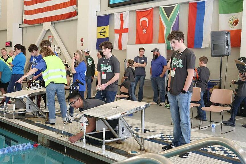 One of the winning teams, the Grant County Aquanauts work together to steer their ROV through the mission course. Members are Garrett Key (left) Priyam Laxmi and Eli Watson. (Special to The Commercial/University of Arkansas Division of Agriculture)