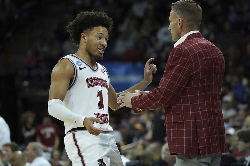 Alabama guard Mark Sears (1) talks with head coach Nate Oats during the second half of Sunday's game against Grand Canyon in the NCAA Tournament in Spokane, Wash. (AP Photo/Ted S. Warren)