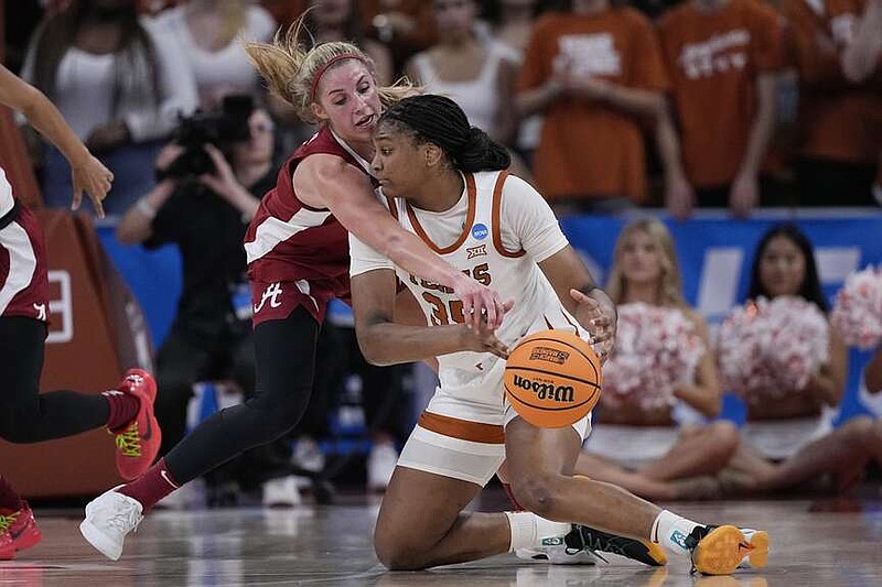 Texas forward Madison Booker, front, and Alabama guard Sarah Ashlee Barker, rear, scramble for a loose ball during the second half of Sunday's game. (AP Photo/Eric Gay)
