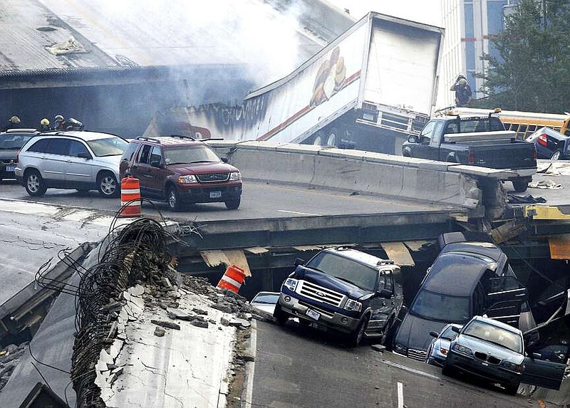 In this Wednesday, Aug. 1, 2007, picture, vehicles are scattered along the broken remains of the Interstate 35W bridge, which stretches between Minneapolis and St. Paul, after it collapsed into the Mississippi River during evening rush hour.  The collapse of the Francis Scott Key Bridge in Baltimore following a ship strike on March 26, 2024, brought back jarring memories of their own ordeals to people who survived previous bridge collapses. (Stacy Bengs/The Minnesota Daily via AP)