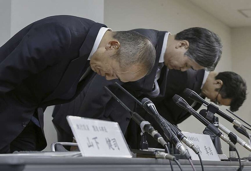 Akihiro Kobayashi, President of Kobayashi Pharmaceutical Co., left, bows during a press conference in Osaka, on March 22, 2024. Health supplement products believed to have caused a few deaths and sickened more than a hundred people have been ordered taken off store shelves in Japan. The products from Kobayashi Pharmaceutical, billed as helping lower cholesterol, contained an ingredient called “benikoji,” a red species of mold.(Chiaki Ueda/Kyodo News via AP)