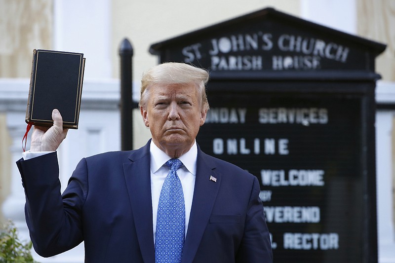 FILE - President Donald Trump holds a Bible as he visits outside St. John's Church across Lafayette Park from the White House, June 1, 2020, in Washington.  Trump is now selling Bibles as he runs to return to the White House. The presumptive Republican nominee released a video on his Truth Social platform Tuesday urging his supporters to purchase the &#x201c;God Bless The USA Bible.&quot; (AP Photo/Patrick Semansky, File)